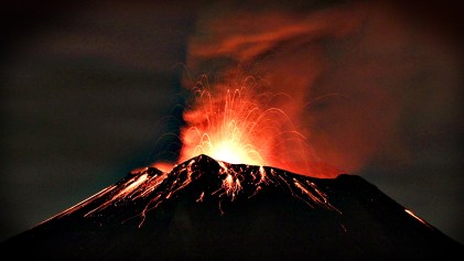 Smoke rises from the Popocatepetl as it spews incandescent volca